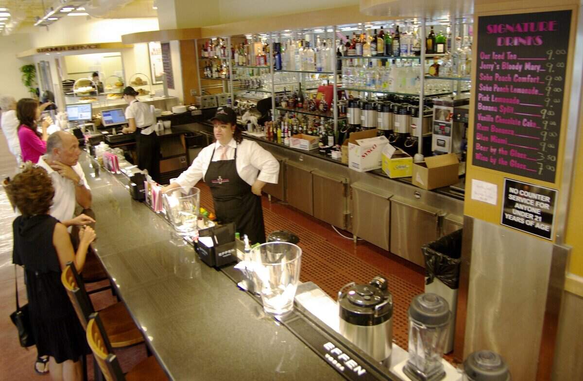 In 2008, shoppers stop at the Epicure Market bar for a cocktail in Sunny Isles Beach.